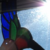 the_bird_colored_glass_glare